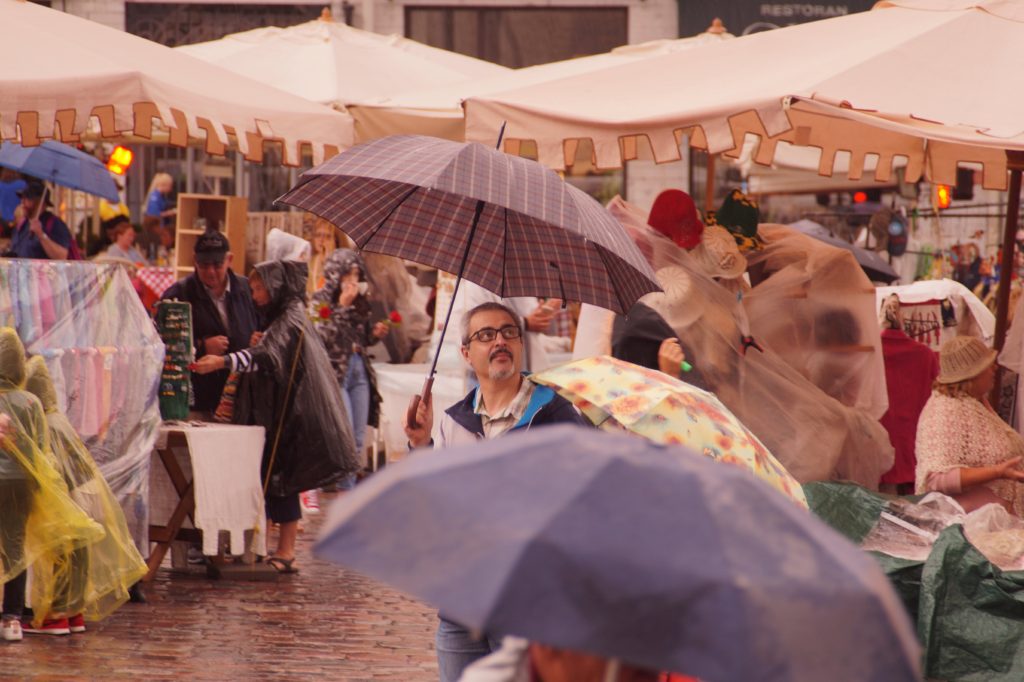 Adult man with umbrella