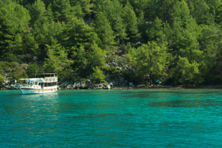 Recreation on the boat near the shore of a mountain