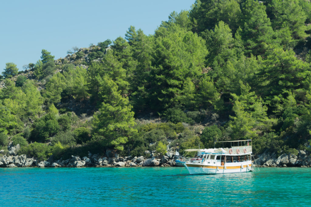 Recreation on the boat near the shore of a mountain