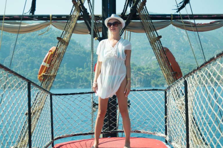 Girl posing on the deck of a ship