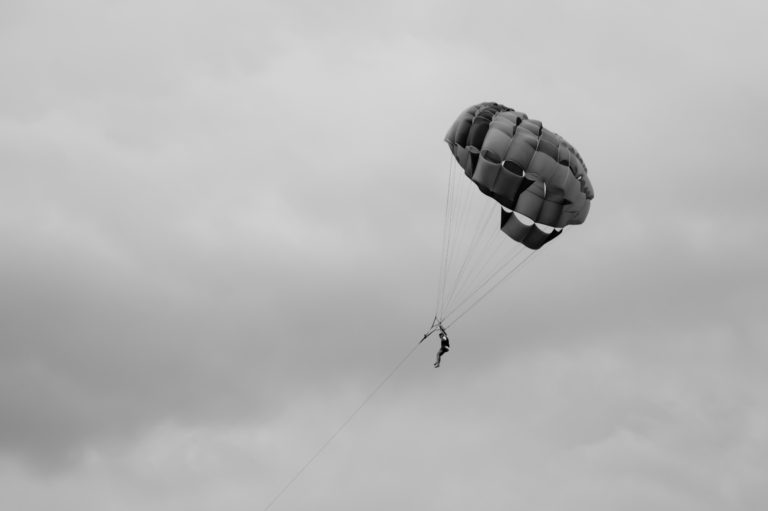 Skydiver flying with a parachute