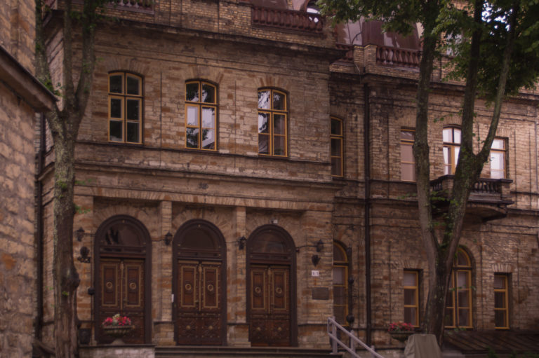 vintage old house with wooden doors and windows background