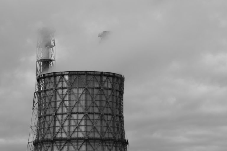 Thermal power plant with smoking chimney. Industrial background